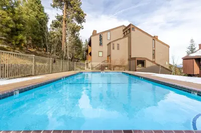 a swimming pool in the backyard of a house at Epic Condo walk to Canyon Lodge in Mammoth Lakes