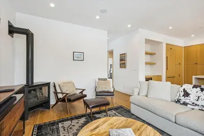 a living room with a couch and a fireplace at Diamond Run at Palisades - Luxury Townhome, Ski Shuttle Pet Friendly and Hot Tub! in Olympic Valley