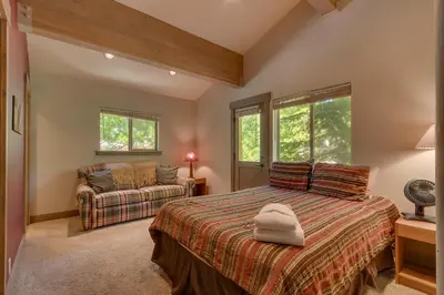 a bedroom with a bed and a couch at High Sierra at Dollar Point - Private Hot Tub, Close to Ski Resorts, Pet Friendly! in Tahoe City