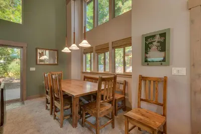 a dining room with a wooden table and chairs at High Sierra at Dollar Point - Private Hot Tub, Close to Ski Resorts, Pet Friendly! in Tahoe City