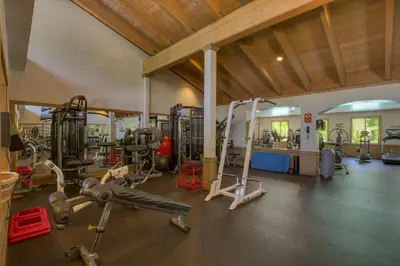 a gym with several treadmills and exercise equipment at Indian Hills at Northstar by Tahoe Getaways - Spacious 4 BR, Private Hot Tub, Wood Fireplace, and HOA Amenities in Truckee