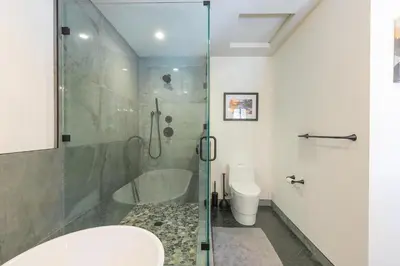 a bathroom with a glass shower and a toilet at Kokanee at Tahoe Donner - Charming 3 BR - Pool Table - Fireplace - Amenity Access! in Truckee
