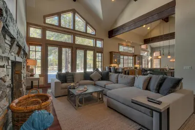 a living room with a couch and a fireplace at Mountain Majesty at Grays Crossing - Luxury 4BR 4BA w Private Hot Tub in Truckee