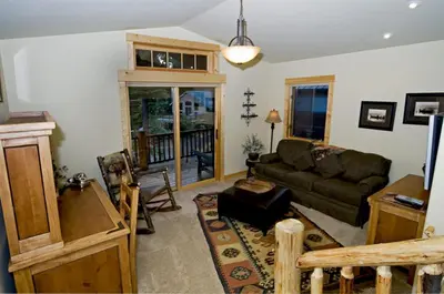 a living room with a couch and a table at Olive Branch - Private Hot Tub, Media Room, Pet-Friendly, Near Northstar! in Carnelian Bay