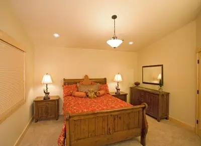 a bedroom with a bed with a teddy bear on it at Olive Branch - Private Hot Tub, Media Room, Pet-Friendly, Near Northstar! in Carnelian Bay