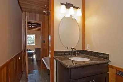 a bathroom with a sink and a mirror at Pioneer Lake View- 4BR Easy Walk to Town Private Hot Tub - Sleeps 11 in Tahoe City