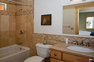 a bathroom with a toilet and a sink and a tub at Red Cedar on North Shore - Beautiful 3BR w Gorgeous Furnishings in Tahoe City in Tahoe City