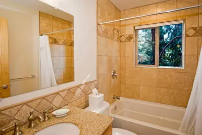 a bathroom with a sink and a tub and a toilet at Red Cedar on North Shore - Beautiful 3BR w Gorgeous Furnishings in Tahoe City in Tahoe City