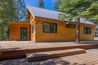 a wooden house with a metal roof at Wildwood - Modern 2 BR with Private Hot tub Walk to North Tahoe Regional Park in Tahoe Vista