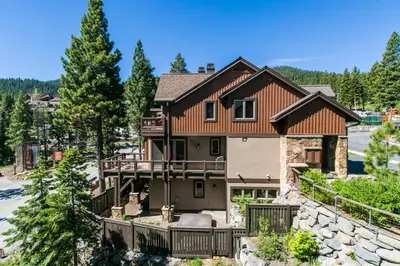 an exterior view of a house with a balcony at Village Walk - Private Hot Tub, HOA Amenities, Pet Friendly, Walk to Lifts! in Truckee