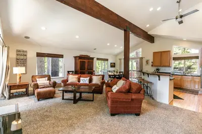 a large living room with couches and a kitchen at Wolf Den - Bright Open Concept 3 Bedroom- Hot Tub, Pet-Friendly, Minutes from Skiing! in Tahoma