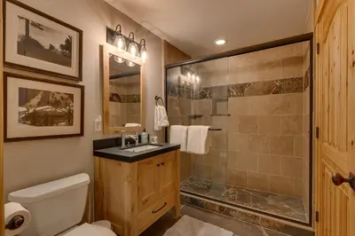 a bathroom with a shower and a toilet and a sink at Woodcrest at Tahoe Donner 3BR with Pool Table - 3000 sq ft in Truckee