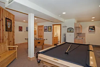 a large room with a pool table in it at Woodside Lodge on West Shore with Private Hot Tub, Pool Table & Game Room in Tahoma