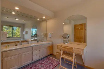 a bathroom with two sinks and a mirror at Stockholm - Beautiful Views in Tahoe Donner - Private Hot Tub - Pet Friendly in Truckee
