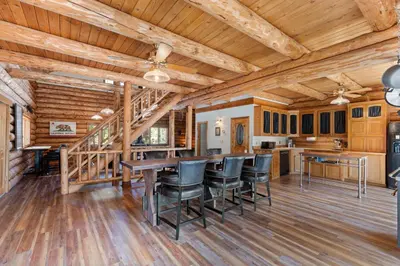 a kitchen and dining room with a table and chairs at Tahoe Wanderer - 3 BR Luxury Log Cabin with Additional Loft, Private Hot Tub in Tahoe Vista