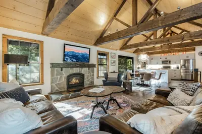 a living room with couches and a fireplace at Timber Grove at Tahoe Park - Gorgeous 4BR Cabin - Tahoe Park HOA, Pets OK, Near Skiing in Tahoe City