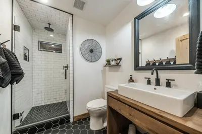 a bathroom with a sink and a toilet and a shower at Timber Grove at Tahoe Park - Gorgeous 4BR Cabin - Tahoe Park HOA, Pets OK, Near Skiing in Tahoe City