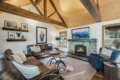 a living room with a couch and a fireplace at Timber Grove at Tahoe Park - Gorgeous 4BR Cabin - Tahoe Park HOA, Pets OK, Near Skiing in Tahoe City
