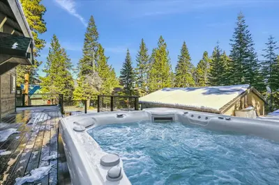 a hot tub in the backyard of a house at Granlibakken Getaway by Tahoe Getaways - West Shore Retreat-Central Location-Hot Tub-Dog Considered-Near Skiing in Tahoe City
