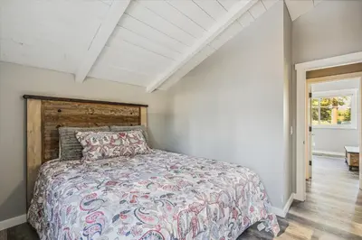 a bedroom with a bed and a white ceiling at Granlibakken Getaway by Tahoe Getaways - West Shore Retreat-Central Location-Hot Tub-Dog Considered-Near Skiing in Tahoe City