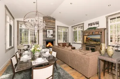 a living room with a couch and a fireplace at First Light Farmhouse- Hot Tub- Gourmet Kitchen- Premier Neighborhood in Truckee