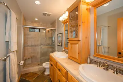 a bathroom with a sink and a toilet at St Bernard at Tahoe Donner Remodeled 3BR - Private Hot Tub and Gym and Pool Access in Truckee