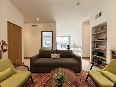 a living room with a couch and two chairs at Stellar Ski-in Ski-out Townhouse 8 - Luxury 3 BR w Private Hot Tub and Gym and Pool Access in Truckee