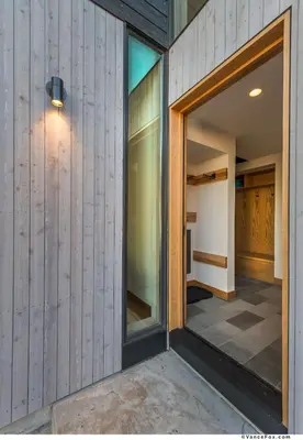 a pivot door in a house with a hallway at Stellar Ski-in Ski-out Townhouse 8 - Luxury 3 BR w Private Hot Tub and Gym and Pool Access in Truckee