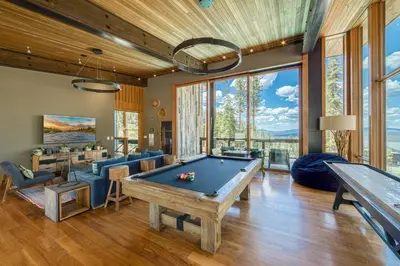 a living room with a pool table at Stellar Ski-in Ski-out Townhouse 8 - Luxury 3 BR w Private Hot Tub and Gym and Pool Access in Truckee