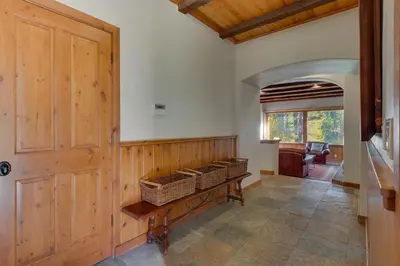 a hallway with wicker baskets on a wooden wall at Swiss Chalet-Palisades, 6 BR, Hot Tub, Pets Ok, Ski Shuttle! in Olympic Valley