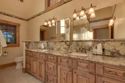 a bathroom with a sink and a large mirror at Highland Estate at Old Greenwood - Large, Luxury, Private Hot Tub & Amenity Access in Truckee