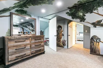 a room with a dresser and a mirror at Beach Haven Lakefront - On a Sandy Beach with Guest House in Kings Beach