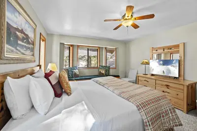 a bedroom with a bed and a ceiling fan at 4 Bedroom Home at 392 Skidder Trail home in Truckee