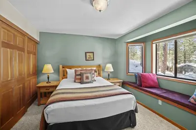 a bedroom with a bed and a window at 4 Bedroom Home at 392 Skidder Trail home in Truckee