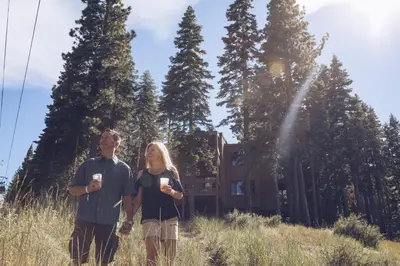 a man and a woman standing in a field at 4 Bedroom Home at 392 Skidder Trail home in Truckee