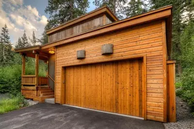 a wooden garage with a large door at Alpine Adventure- Shuttle to Ski Lifts- Hot Tub- Pet Friendly in Alpine Meadows