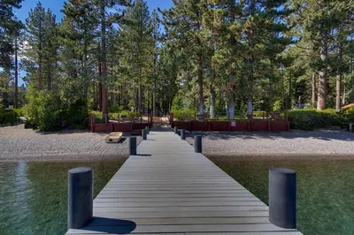 a wooden walkway over the water in a park at Antler House- Quiet, Charming Cabin w Cozy Fireplace, Close to Skiing in Tahoe City