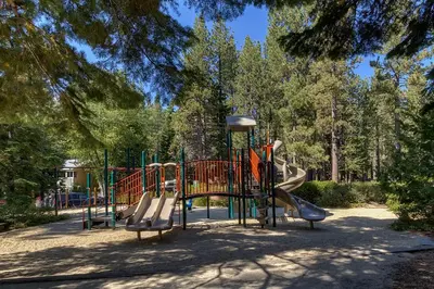 a playground with a slide in a park at Antler House- Quiet, Charming Cabin w Cozy Fireplace, Close to Skiing in Tahoe City