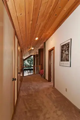 an empty hallway with a wooden ceiling in a house at Alpine Darling- Hot Tub- Pet Friendly- 3 Minute Drive to Palisades Tahoe in Alpine Meadows