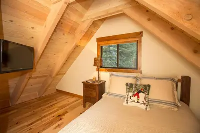 a bedroom with a bed in a attic at Away on Allenby by Tahoe Getaways - 3BR, Dog Ok, Close to Northstar! in Tahoe Vista