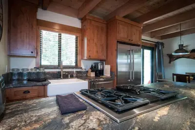a kitchen with a stove top oven in a kitchen at Away on Allenby by Tahoe Getaways - 3BR, Dog Ok, Close to Northstar! in Tahoe Vista