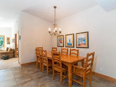 a dining room with a wooden table and chairs at Amazing mountain setting in Incline Village