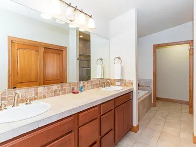 a bathroom with two sinks and a large mirror at Amazing mountain setting in Incline Village