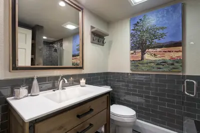 a bathroom with a sink and a toilet at 101 McCloud - Simply Elegant in Incline Village