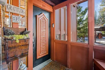 an entrance to a store with a wooden door at Magnificent 2-bedroom, 2-bath lakefront complex in Incline Village