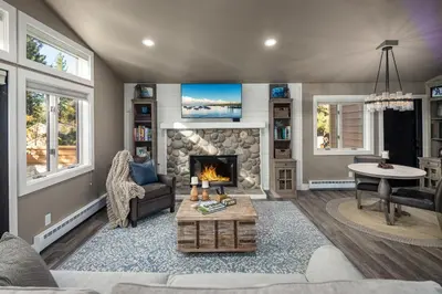 a living room with a fireplace and a couch at 128 McCloud - Luxury Couples Retreat in Incline Village