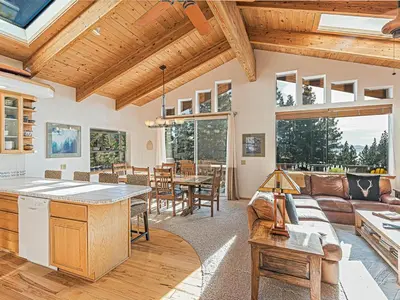 a living room with a couch and a table at Fantastic Lakeview house with large decks! in Incline Village