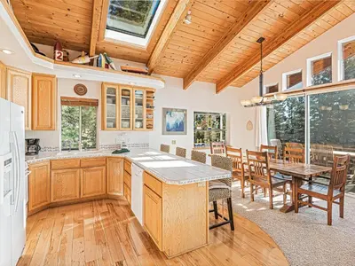 a kitchen and dining room with a table and chairs at Fantastic Lakeview house with large decks! in Incline Village