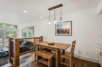 a dining room with a wooden table and chairs at 153 McCloud The perfect location! Enjoy the sun drenched deck in Incline Village