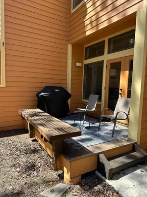 a patio with a grill and chairs on a house at 147 McCloud - The Perfect McCloud Getaway in Incline Village